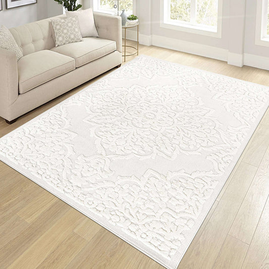 Modern 5x7 cream indoor area rug with a textured high-low medallion pattern and bohemian geometric details in a bright living room.