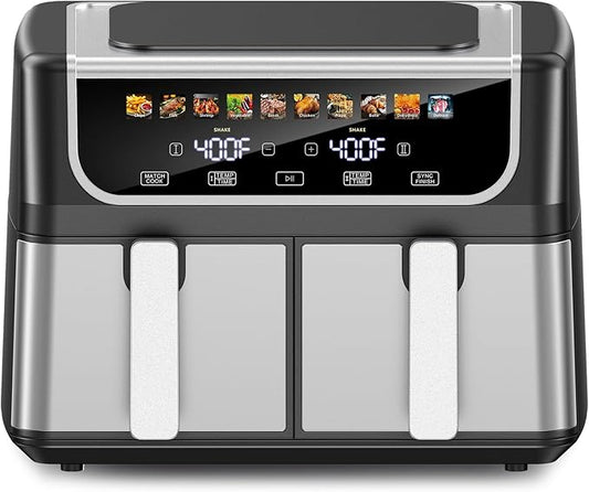 Modern black double-basket air fryer on a kitchen counter with french fries in one basket and chicken wings in the other, showing the digital touch display