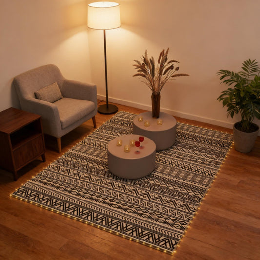 Modern reversible outdoor rug with a geometric pattern spread out on a wooden deck patio