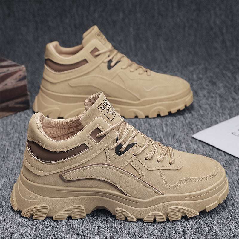 Beige men’s low-top work booties with lace-up, dark trim, and chunky sole