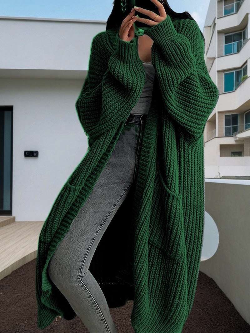 Long knit cardigan coat in dark green with open front, long sleeves, chunky textured knit