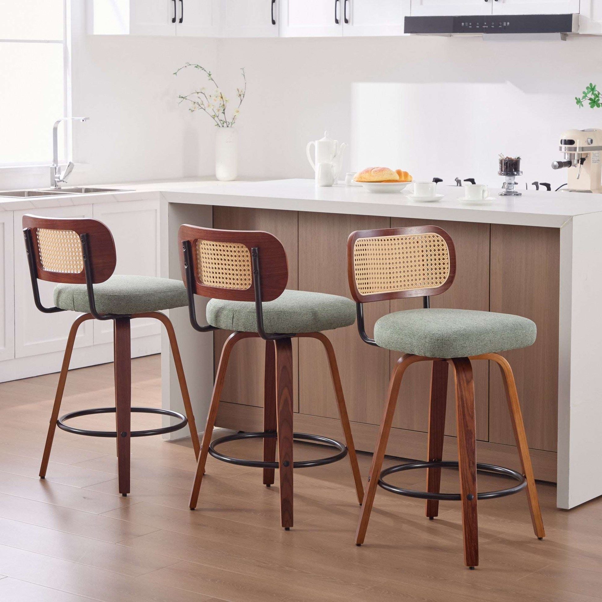 Set of 3 swivel counter stools, light green linen seats, cane rattan backs, dark wood