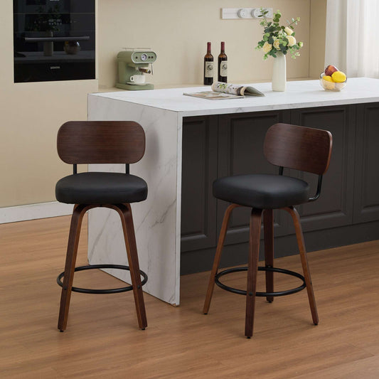 Set of two mid-century modern 26-inch swivel bar stools featuring black faux leather upholstery, walnut finished backs, and elegant bentwood legs.