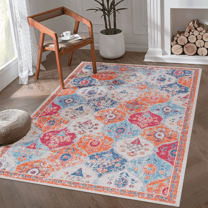 Indoor area rug with cream background and blue, orange, red geometric medallion pattern