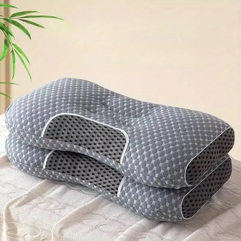 Two YBZ 3D knitted cotton massage pillows with a textured surface for neck support, displayed on a clean bed