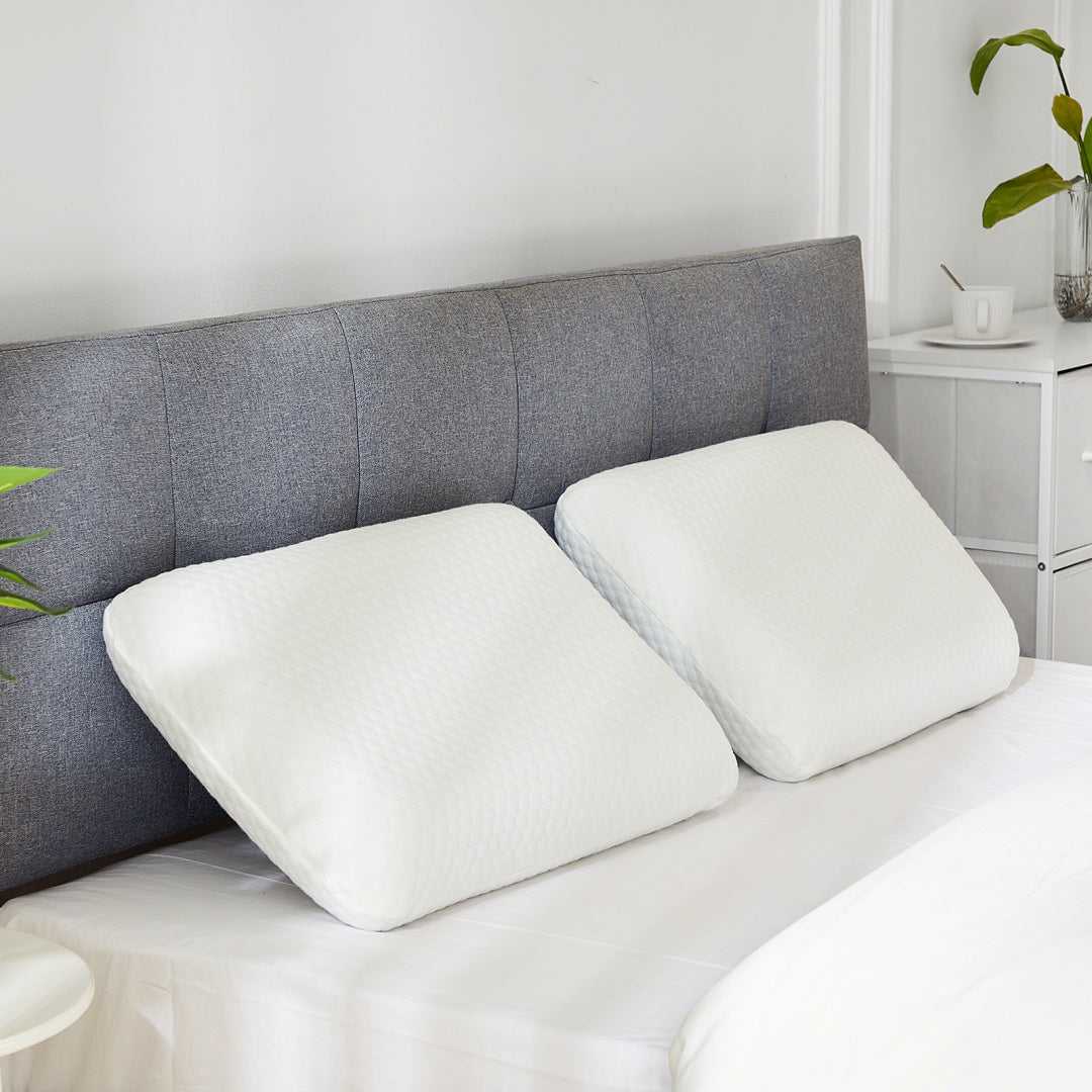 Set of 2 contoured memory foam cervical pillows with off-white covers