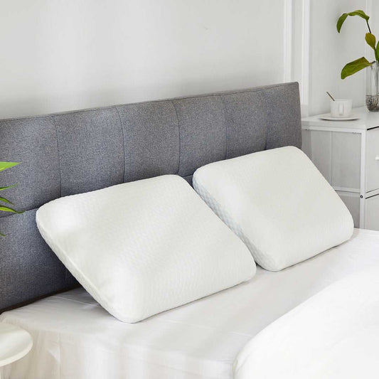 Set of 2 contoured memory foam cervical pillows with off-white covers