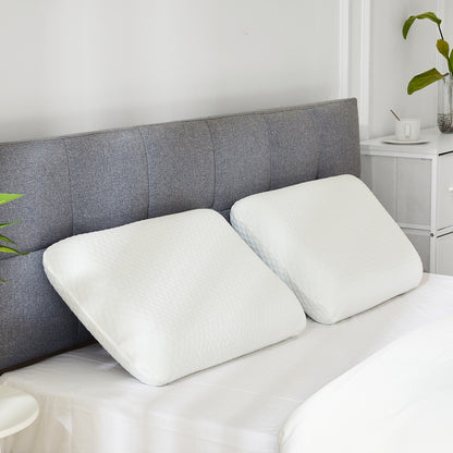 Two white ergonomic memory foam pillows with curved cervical support shape