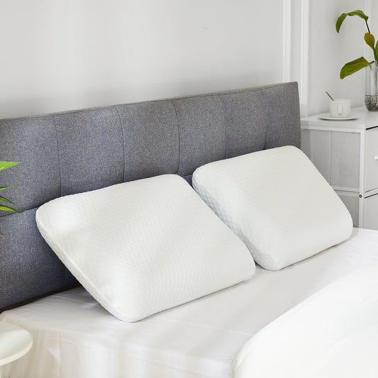 White ergonomic memory foam pillow with a contoured design for neck support and a detachable breathable cover