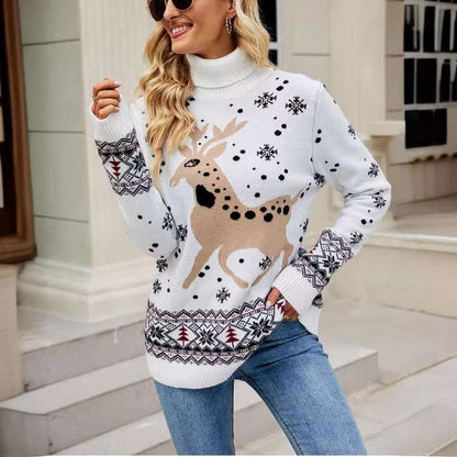 Woman wearing a white sweater with reindeer design outdoors.