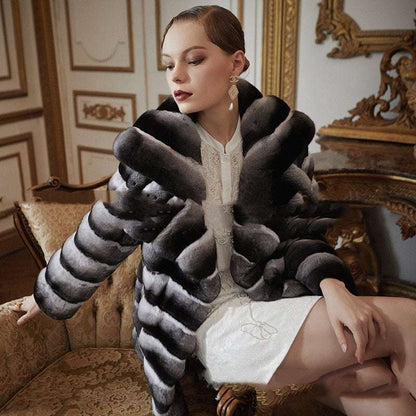 Woman wearing a fur coat in an elegant interior setting