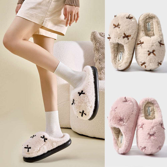 A set of women's plush home slippers with butterfly knot design. The slippers are shown in beige, white, and pink colors with a round toe and thick sole.