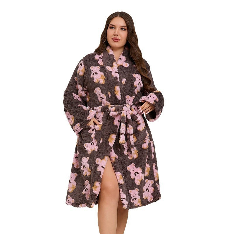 Woman wearing a teddy bear patterned robe on a white background