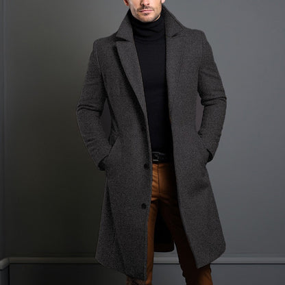 Mid-length trench coat with notched lapels and button front, long sleeves, dark gray.