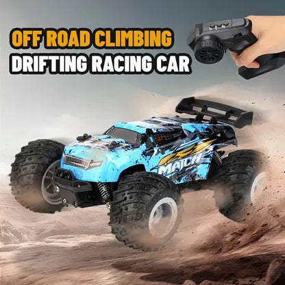 Blue off-road RC toy truck with chunky tires and hand-held remote control