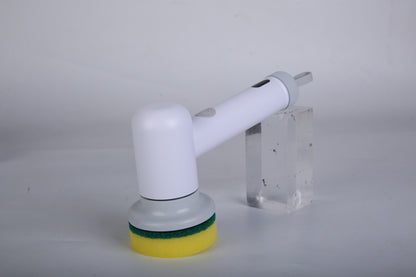 White handheld spin scrubber with yellow base pad scrubbing a surface with water splashes