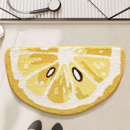 Rounded lemon bath mat with yellow-and-white slice graphic and textured pile