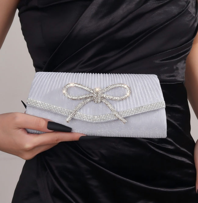 Sparkly bow clutch in white rhinestone fabric with satin bow and bow tie