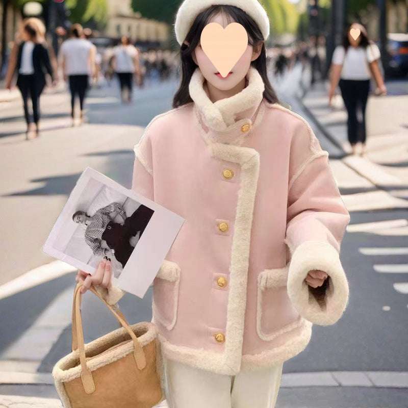 Women’s suede biker jacket in pale pink with sherpa collar and cuff trim, gold snaps.