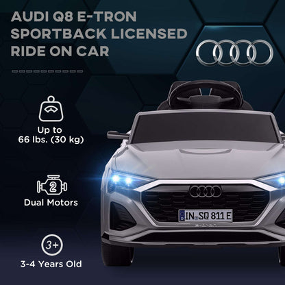 Gray kids ride-on car front view with LED headlights and Audi-style grille emblem