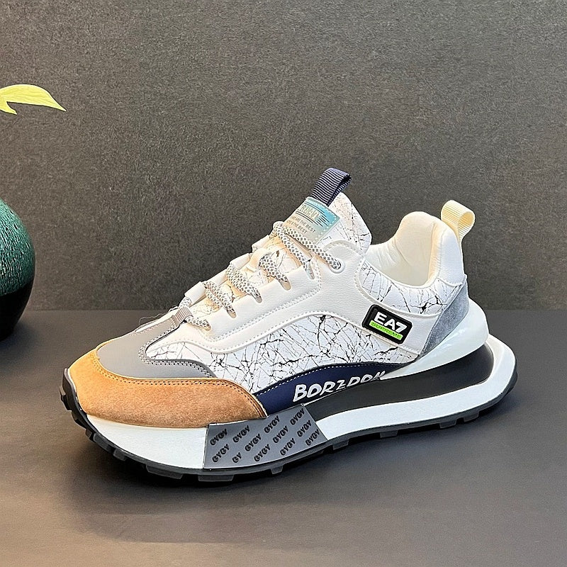 White sneaker with tan front panel, navy heel tab, teal side label, and thick sole