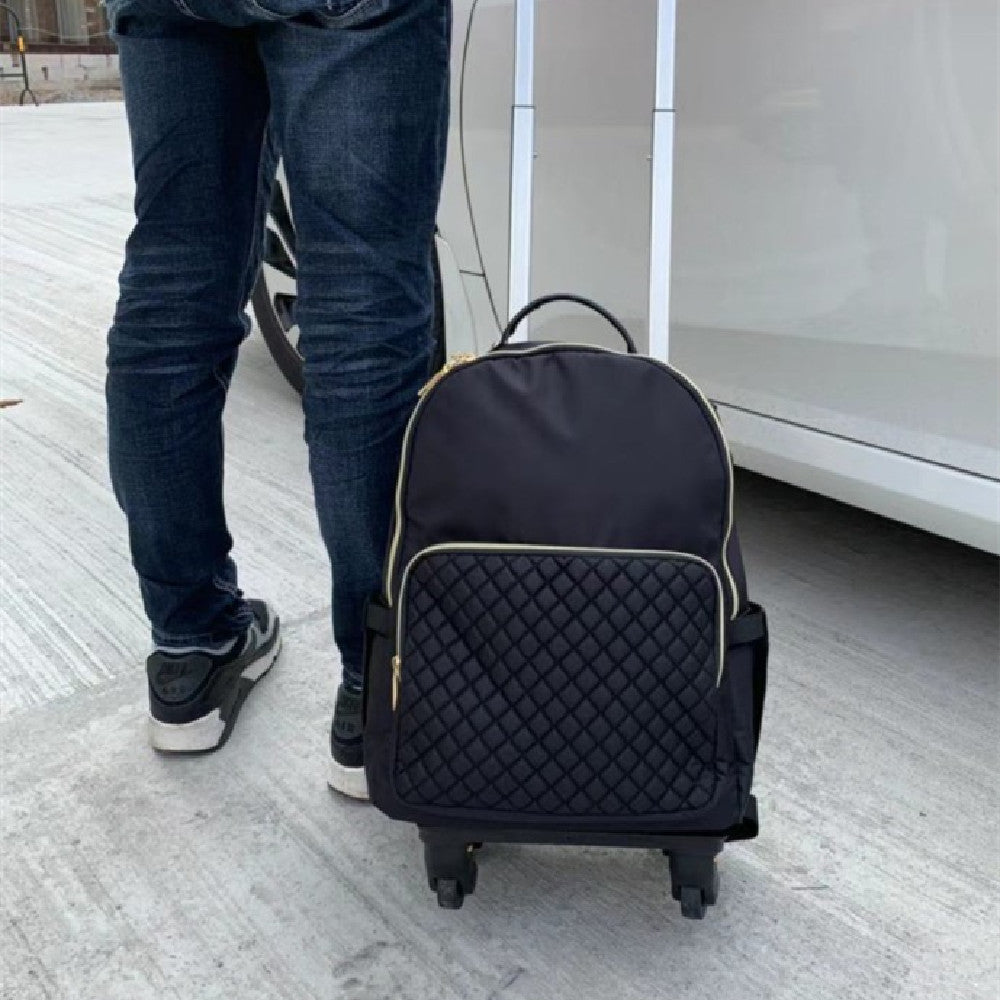 Navy trolley backpack on wheels with quilted front and gold-trim piping