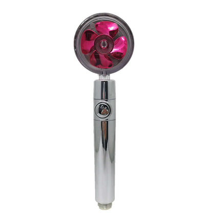 Chrome handheld shower head with pink fan rotor on face