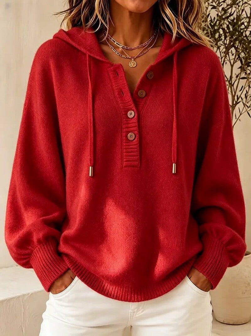 Red hooded knit sweater with button placket, drawstring cords, and ribbed cuffs