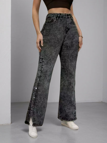 High-waisted dark flared jeans with side buckle accents, relaxed straight front