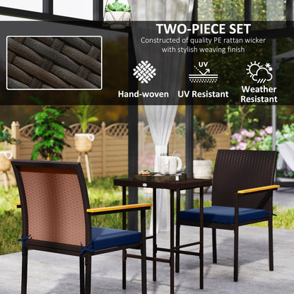 Hand-woven PE wicker patio chair with dark frame, blue cushion, and wood armrests