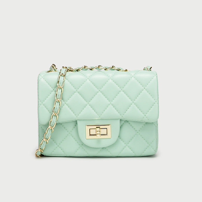 Mint green quilted mini messenger bag with gold chain strap and front flap square clasp