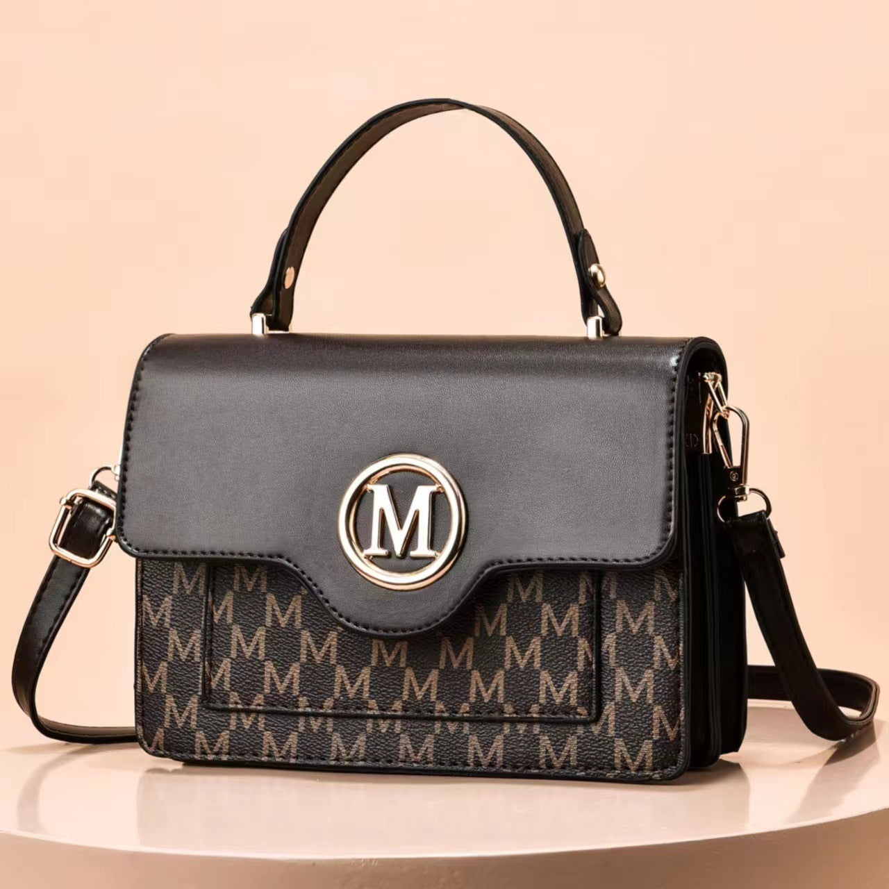 Dark brown printed shoulder bag with flap, top handles, M logo, and crossbody strap