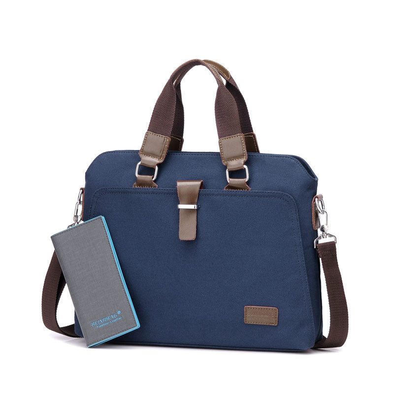 Blue canvas briefcase with top handles, shoulder strap, and a slim gray card holder pouch
