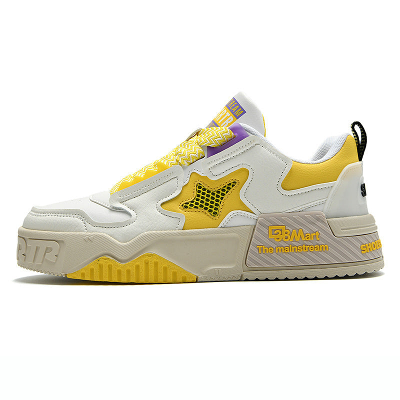 White low top sneakers with yellow mesh panel accents and beige chunky sole