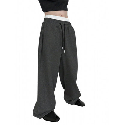 Men's dark gray sweatpants with elastic waist and drawstring, loose straight legs