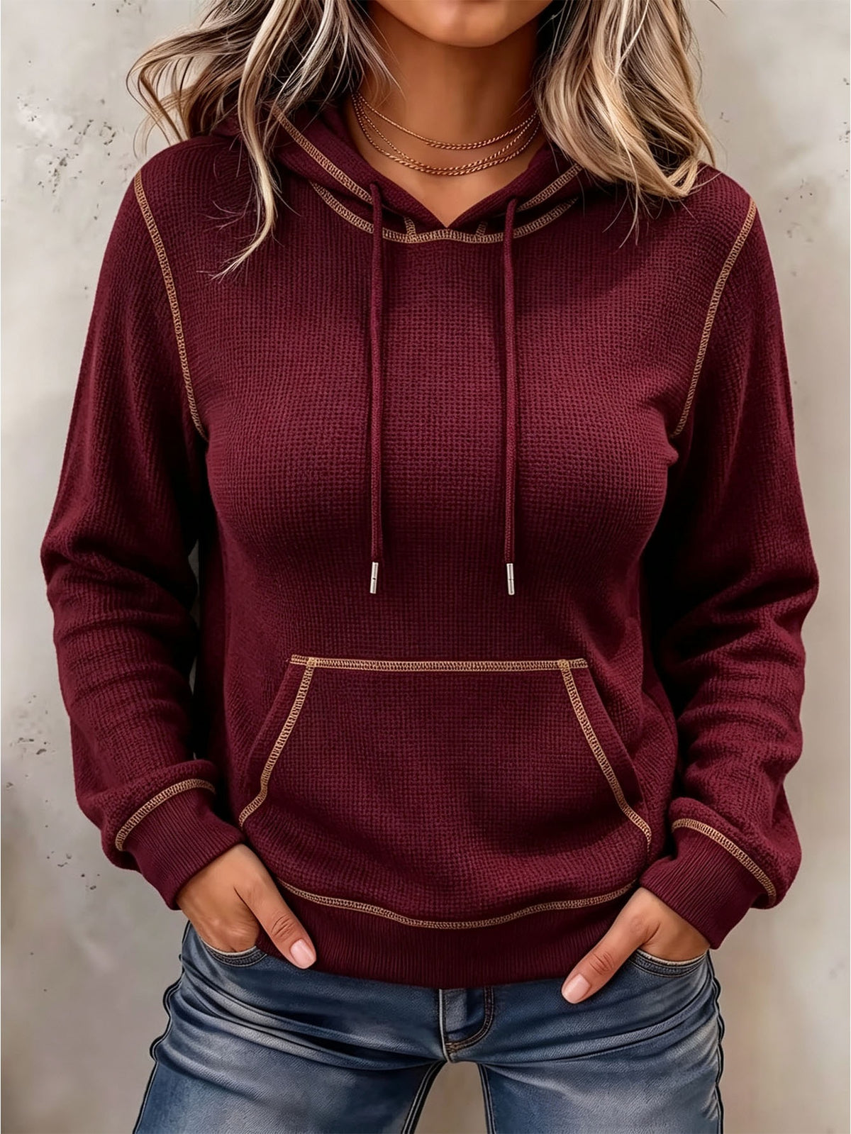 Burgundy long-sleeve hoodie with drawstring hood and front kangaroo pocket