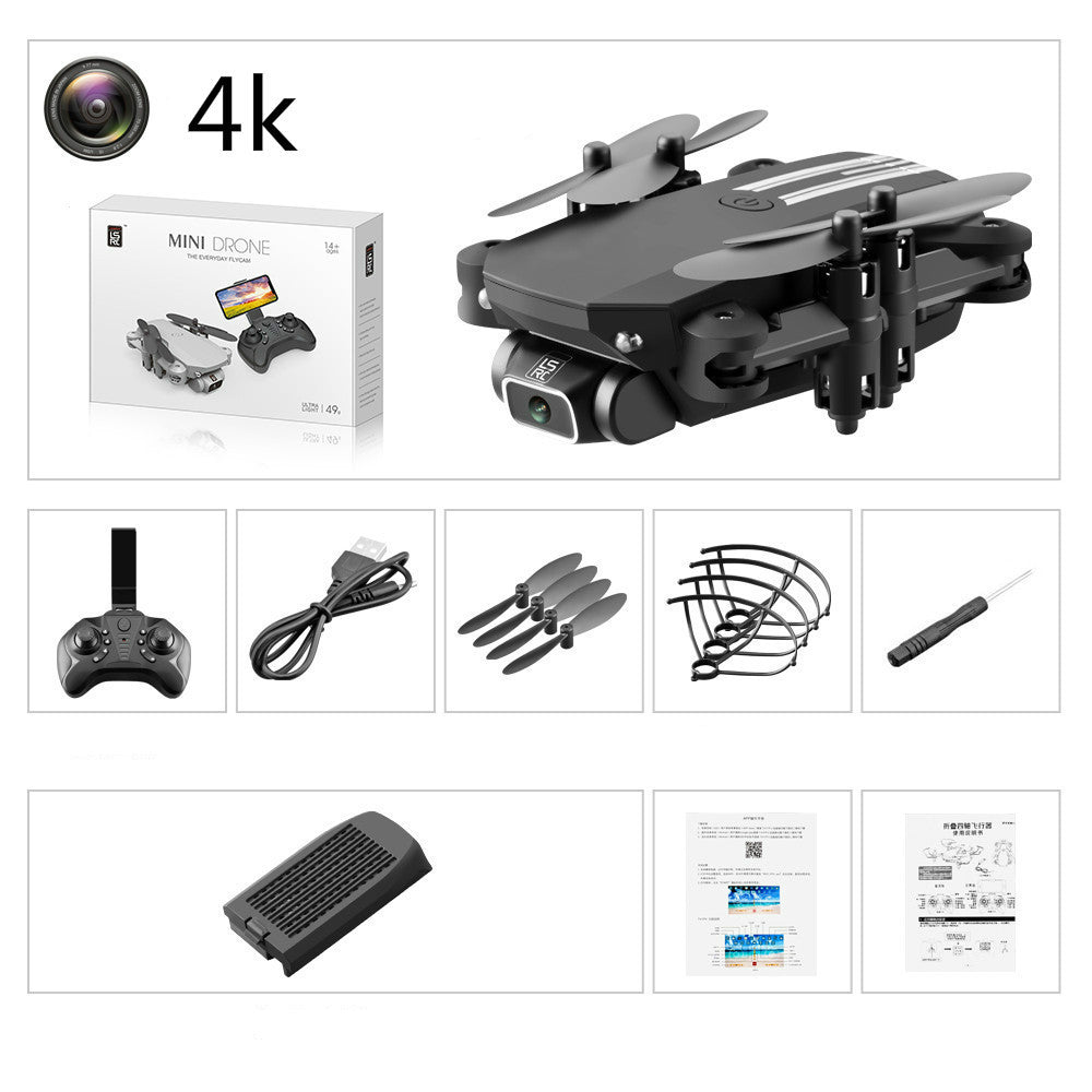 Mini drone with packaging, remote control, and accessories on a white background