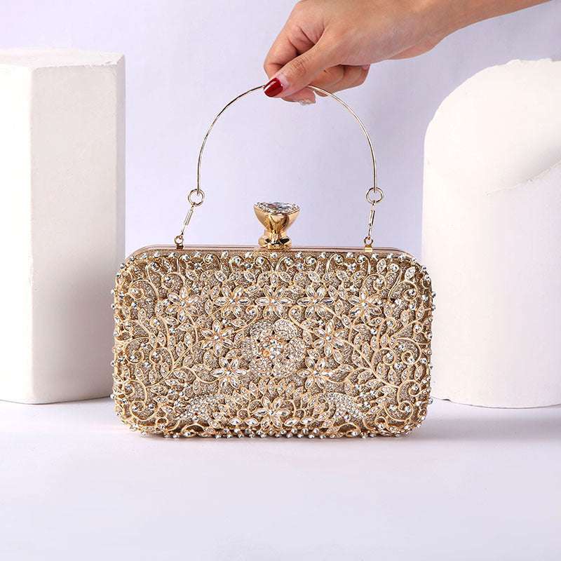 Gold rhinestone clutch with curved handle, ornate lattice front, and clasp