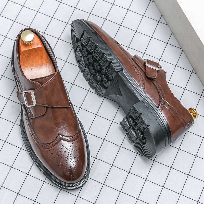 Brown pointed-toe elevator shoes pair with buckle strap and wingtip brogue