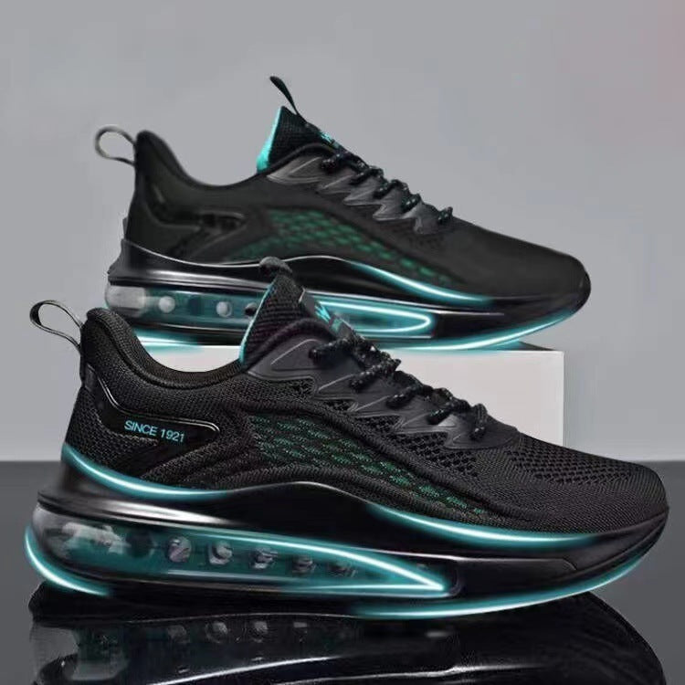 Black and teal running shoes on a reflective surface with a gray background