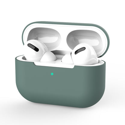 White wireless earbuds in a green case 