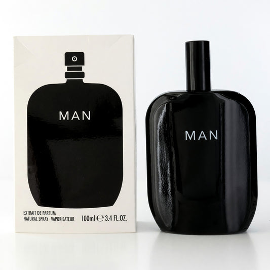 Men's black extrait de parfum spray bottle, 3.4 fl oz, labeled MAN, with box