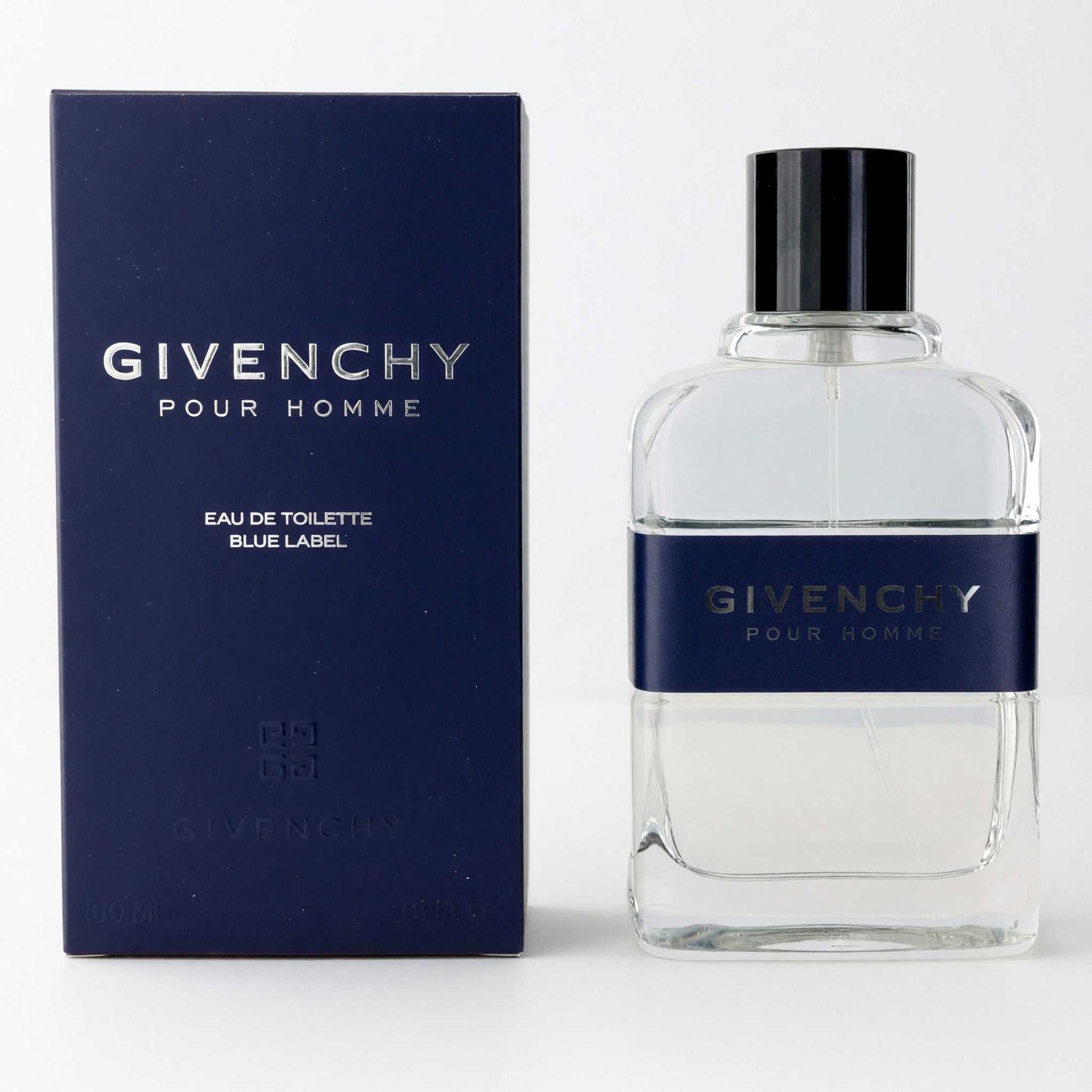 Givenchy Pour Homme Blue Label EDT spray with clear bottle, blue label, black cap.