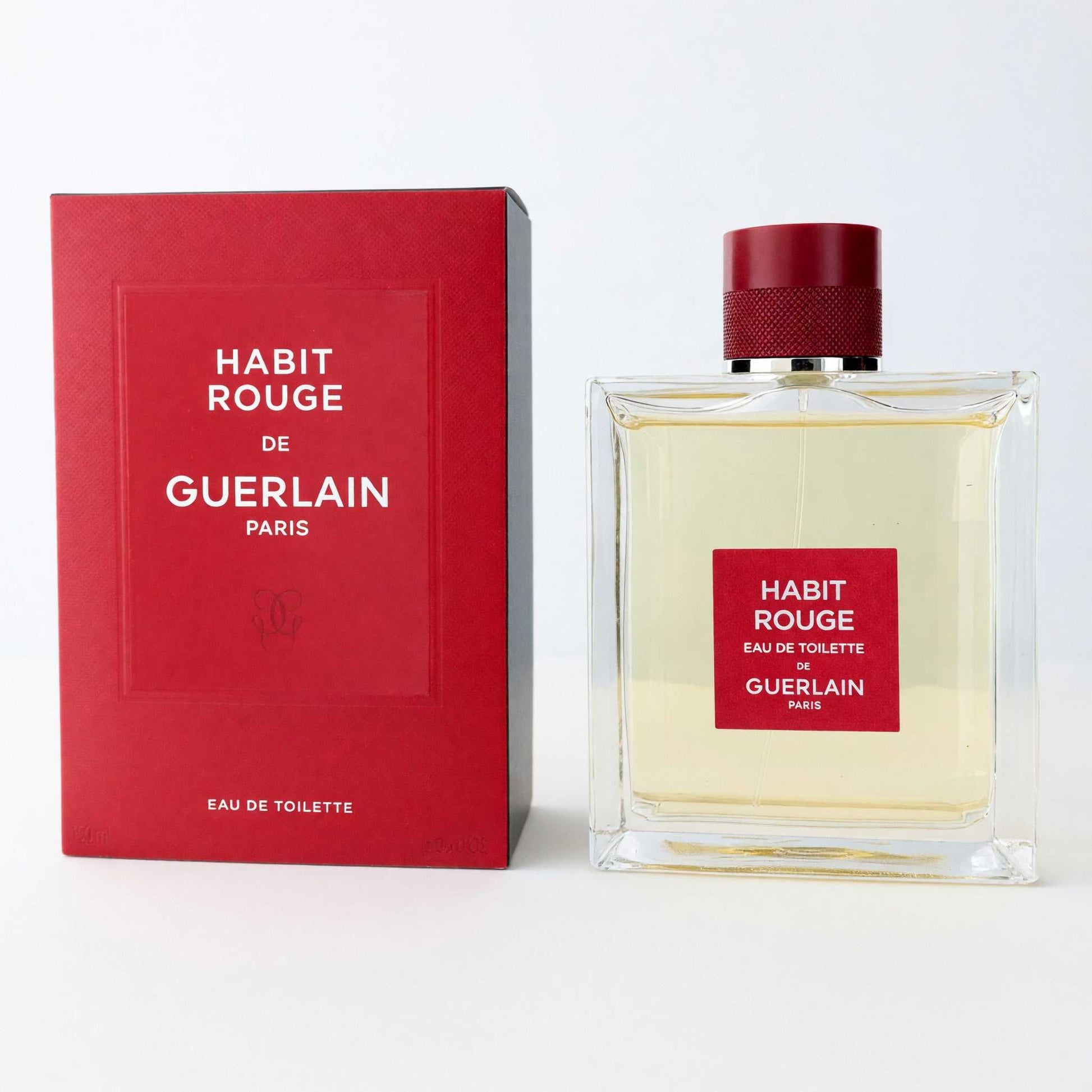 Men's eau de toilette spray bottle with red cap and red GUERLAIN box