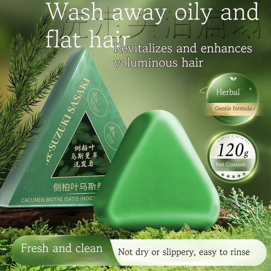 Green triangular soap with text about hair care on a green background