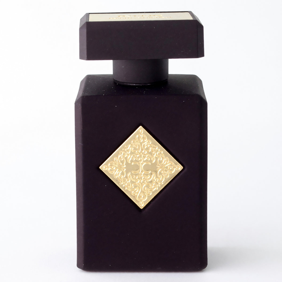 Initio Psychedelic Love unisex perfume spray in a dark bottle with a gold diamond emblem