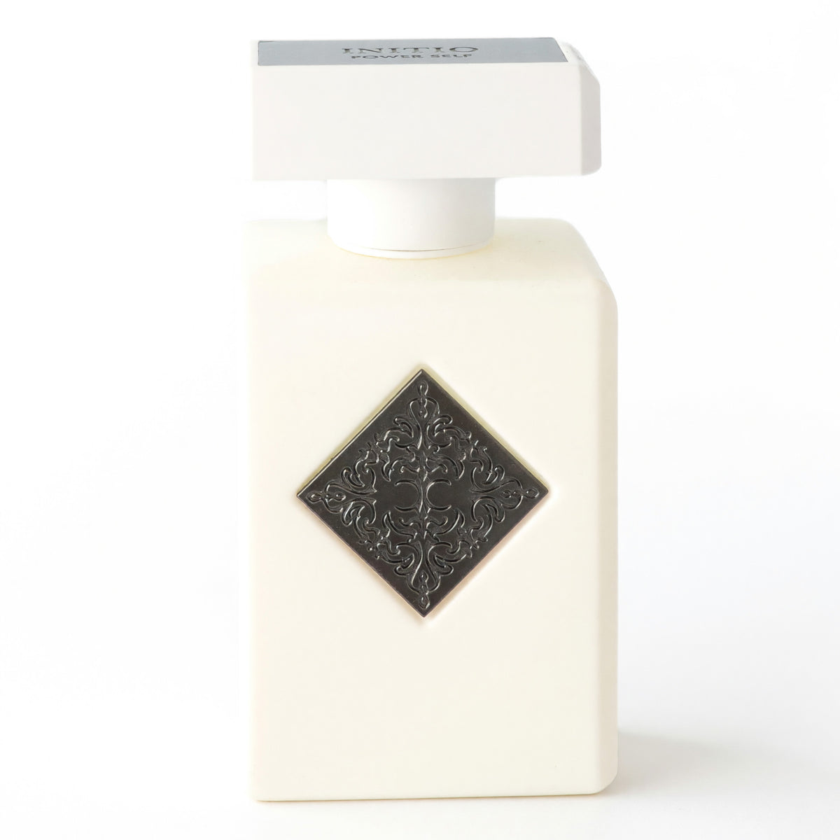 Initio Power Self extrait de parfum spray in an ivory bottle with an ornate diamond emblem