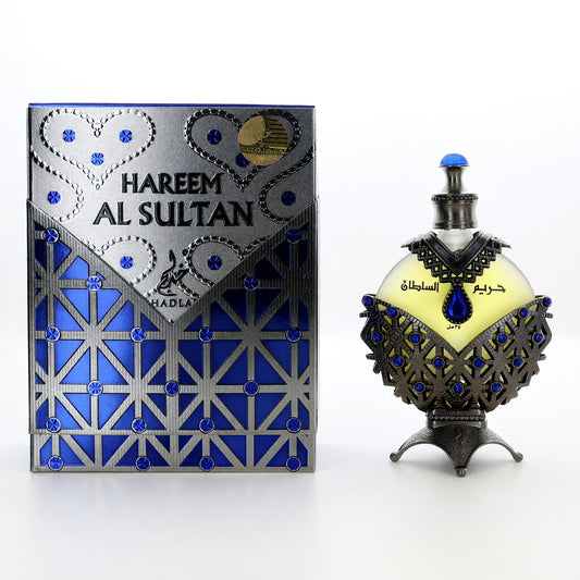 Blue perfume oil bottle with decorative cap and matching box