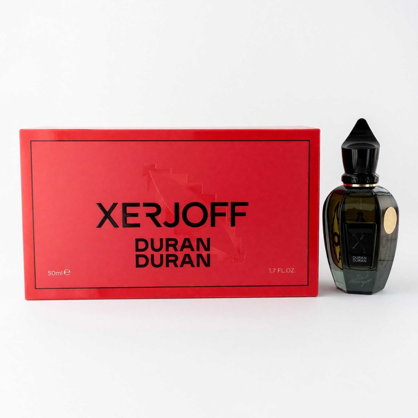 Perfume EDP spray bottle with matching box, dark amber glass and black cap