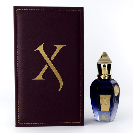 Unisex eau de parfum spray with dark blue bottle, gold cap, and matching box